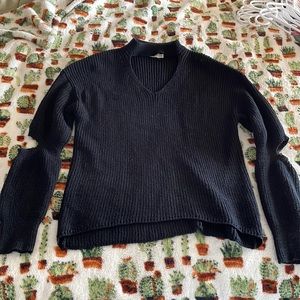 Cute sweater from a boutique. Open elbow design.